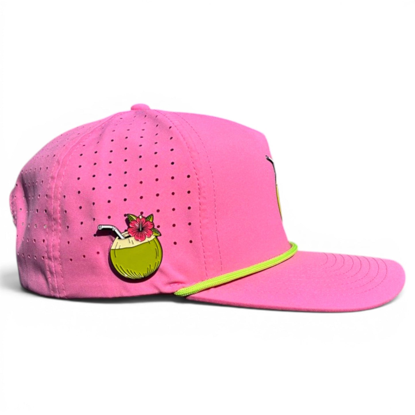 Logie Joe's Golf Coconut Cocktail Golf Hat is a bright pink adjustable snapback cap with a coconut drink graphic, neon yellow-green trim, perforated holes, and features a built-in magnetic ball marker holder with marker included—ideal for style and comfort.