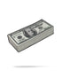 A Cash Stack Ball Marker by Pins and Aces is displayed on a white background next to a stack of U.S. hundred dollar bills, both casting subtle shadows below.