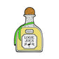 A cartoon-style Tequila Ball Marker by Logie Joe's Golf features a wooden stopper, green ribbon around the neck, and a label reading TEQUILA LOGIE JOES with a small flamingo and decorative accents below the text.