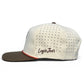 The Longhorn Golf Hat by Logie Joe's Golf is a white snapback cap with a brown brim, black ventilation holes, “Logie Joe’s” in brown script on the side, and features an adjustable tan bull skull plus a built-in magnetic ball marker holder with marker.