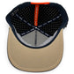 The Parrot Patrol Golf Hat by Logie Joe's Golf features a beige brim with black stitching, a black-and-white polka dot interior, red MAKE YOUR MARK strip, and a built-in magnetic ball marker holder with marker included.