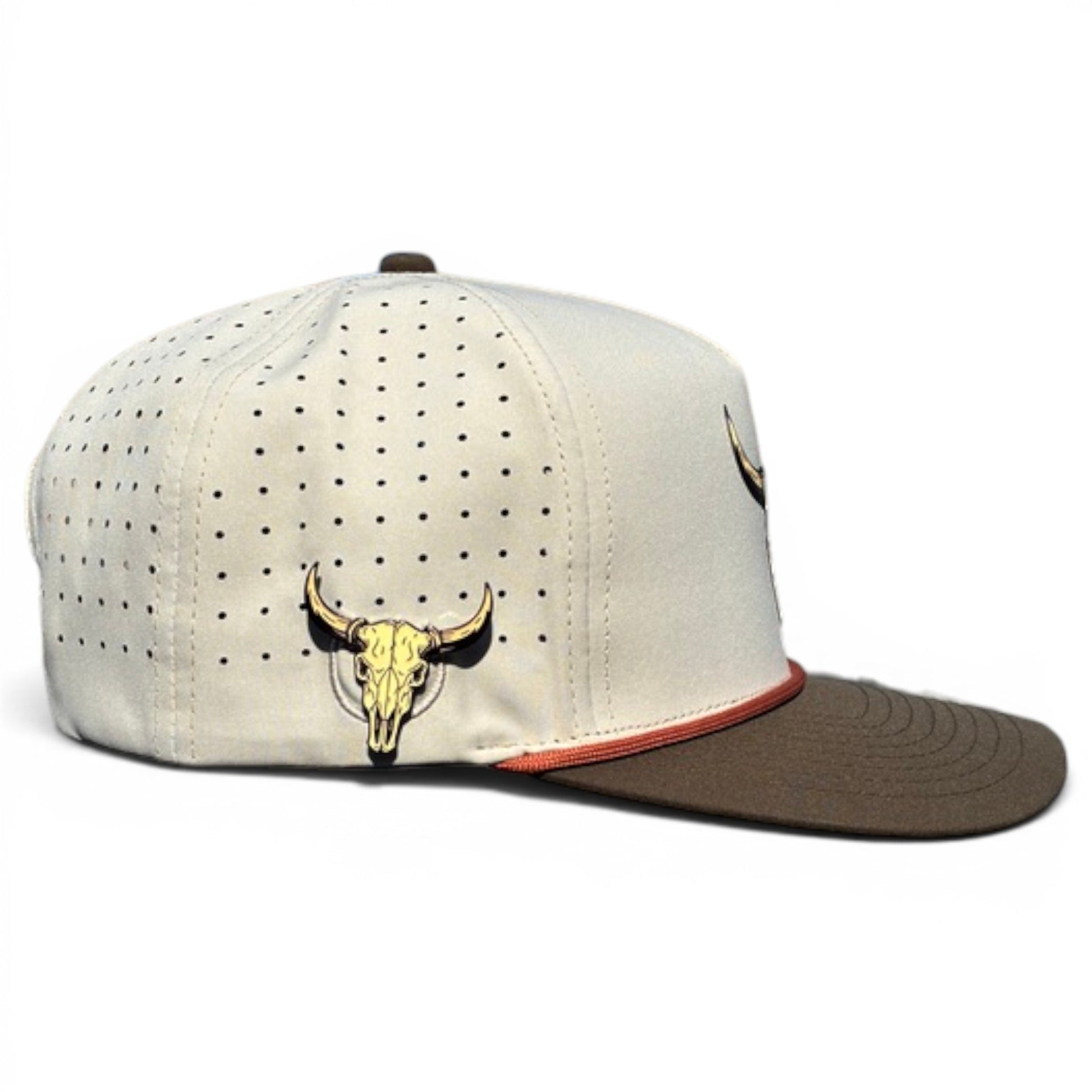 Logie Joe's Golf Longhorn Golf Hat: adjustable beige snapback with brown brim, side ventilation holes, embroidered tan bull skull on the side, built-in magnetic ball marker holder (marker included), and a small red accent above the brim.