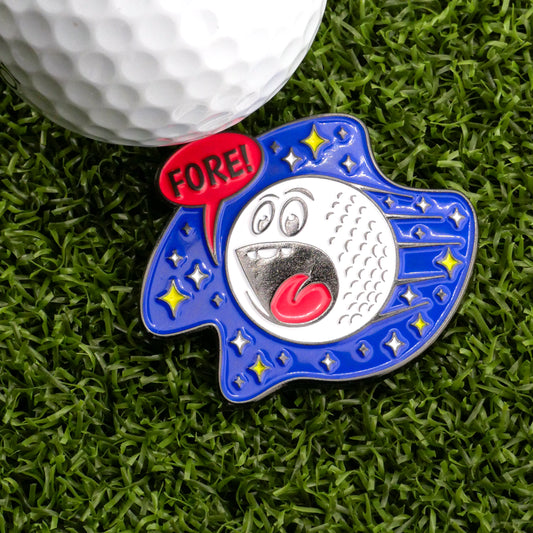 The Space Ball Ball Marker by Ballmarkers.com features a cartoon golf ball with a surprised face and "FORE!" speech bubble set against a blue starry space background, displayed on green artificial grass beside a real golf ball. Mission to Pars!.