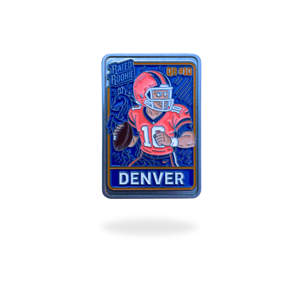 The Denver Trading Card Ball Marker by Pin Creatures features a football player in orange holding a ball, “DENVER” at the bottom, “RATED ROOKIE” at the top left, and blue-orange accents—ideal for Denver fans and collectors.