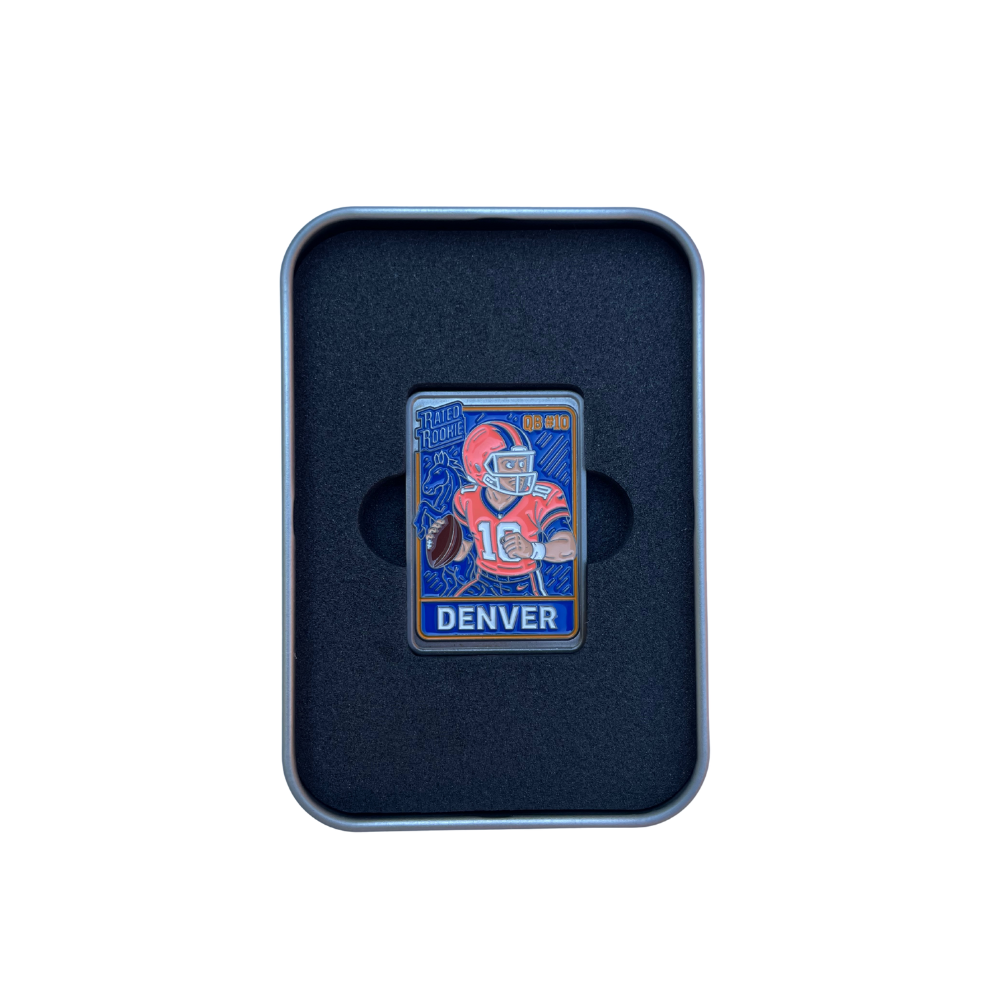 The Pin Creatures Denver Trading Card Ball Marker features a football player in an orange #18 uniform, "DENVER" and Hall of Fame text, displayed in a black foam-lined case.