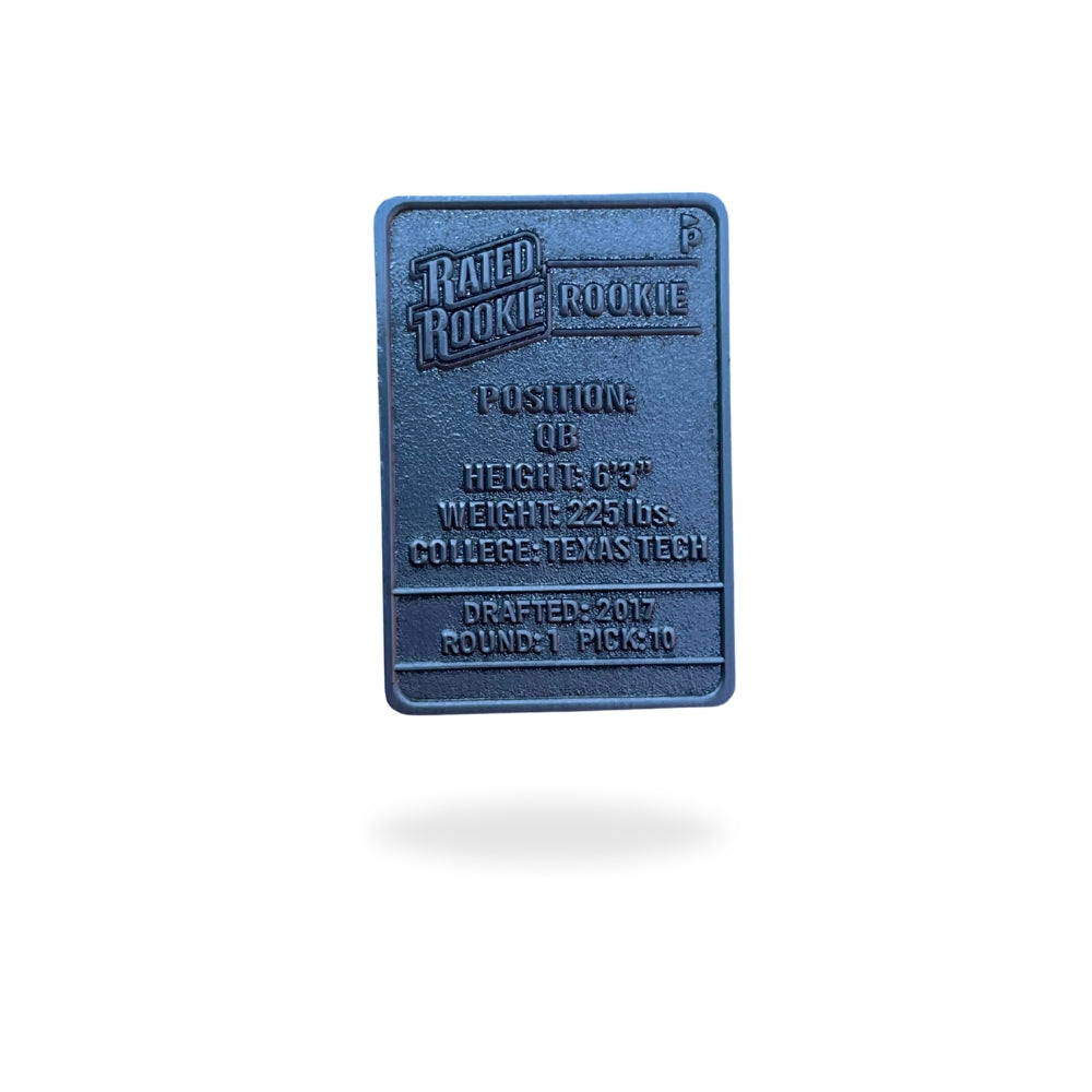 The Kansas City Trading Card Ball Marker by Pin Creatures is a rectangular metallic ball marker with embossed "Rated Rookie Rookie" text, showing QB stats: 6'3", 223 lbs, Texas Tech, drafted 2017 (Round 1, Pick 10), and casts a shadow below.