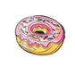 The Pins and Aces Donut Ball Marker is a playful enamel steel marker shaped like a pink and yellow doughnut with sprinkles.