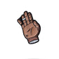 The Chubs Hand Ball Marker by Pins and Aces features a cartoon-style brown hand with scrapes and bandages, little finger extended in a closed fist, set against a white background with enamel paint accents and a faint shadow.