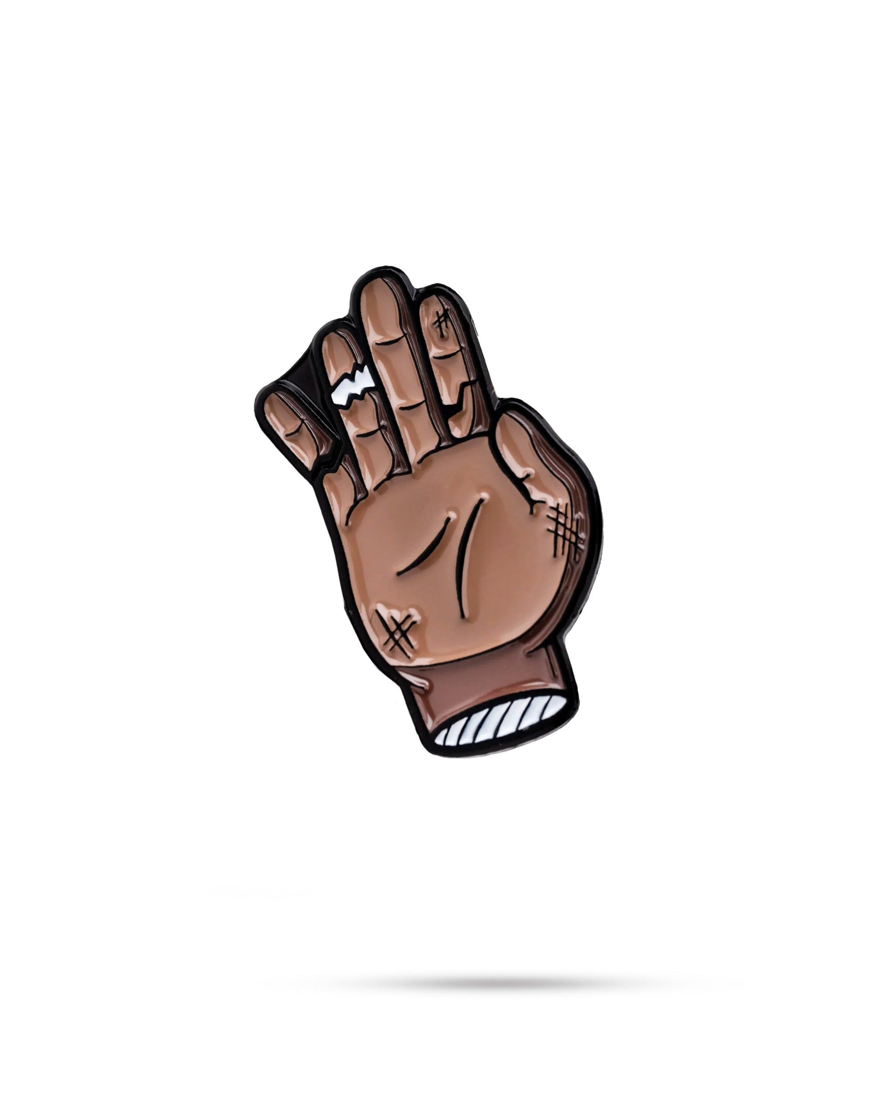The Chubs Hand Ball Marker by Pins and Aces features a cartoon-style brown hand with scrapes and bandages, little finger extended in a closed fist, set against a white background with enamel paint accents and a faint shadow.