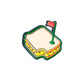 The Pimento Cheese Sandwich Ball Marker by Pins and Aces features a cartoon-style sandwich with a bite out of one corner, topped with a red flag sandwich marker. Layers of bread, cheese, and fillings sit on a white background with a subtle shadow below.