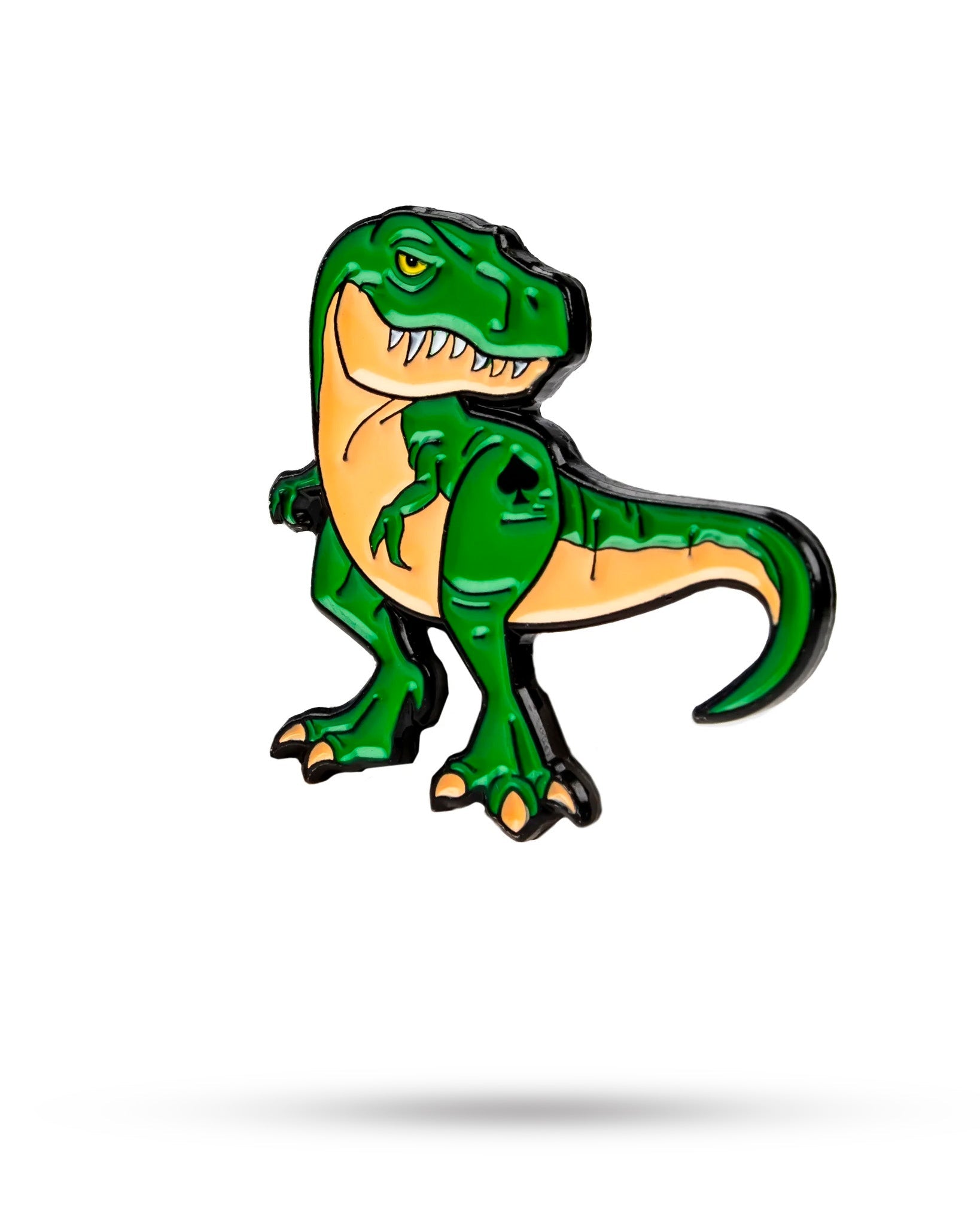 The T Rex Ball Marker by Pins and Aces features a cartoon-style green and tan T. rex in a playful, confident pose, standing upright with sharp teeth showing on a white background with a soft shadow.