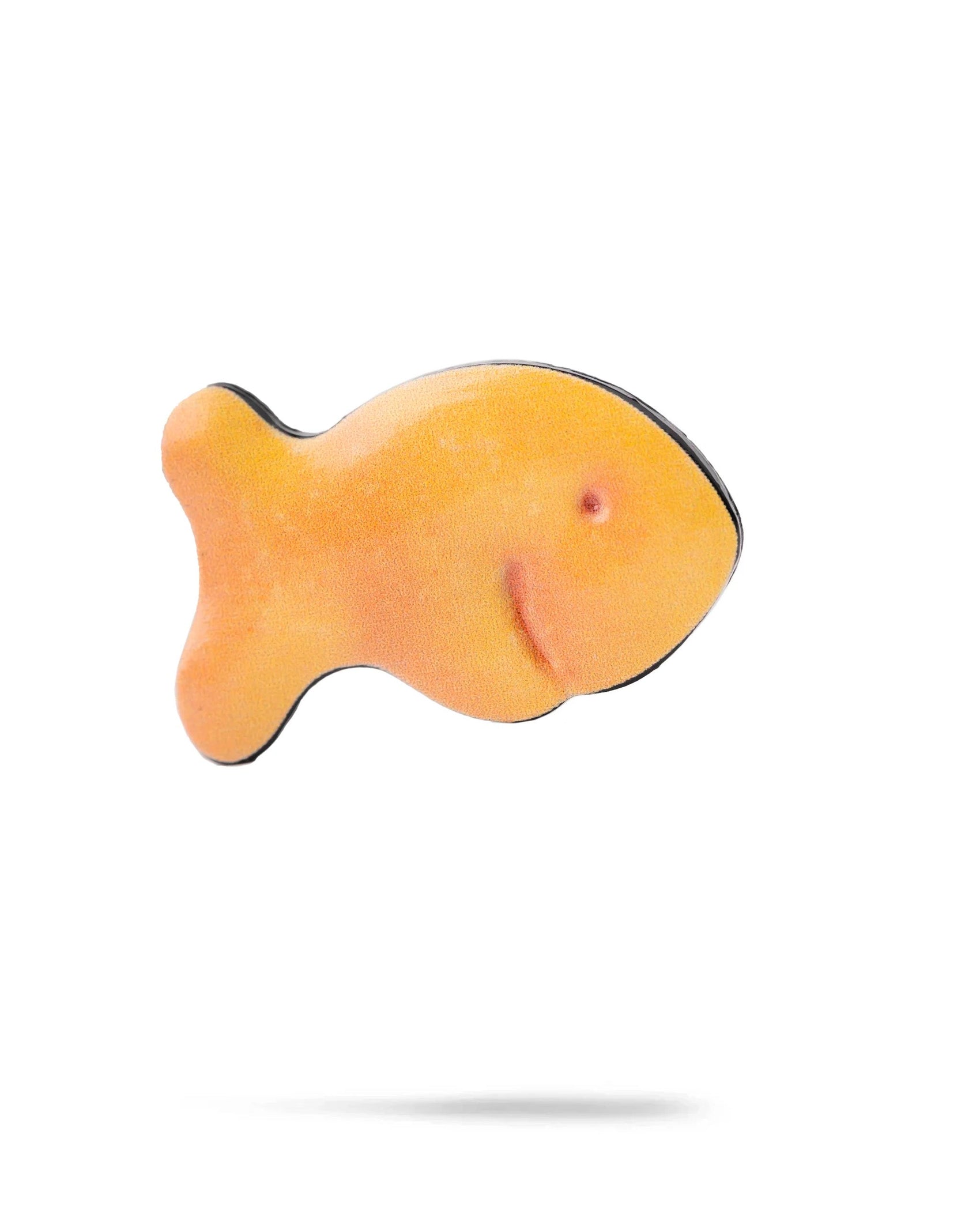 The Fish Cracker Ball Marker by Pins and Aces is shown as a single, orange, fish-shaped marker against a white background with a subtle shadow, highlighting its compact golf accessory design.