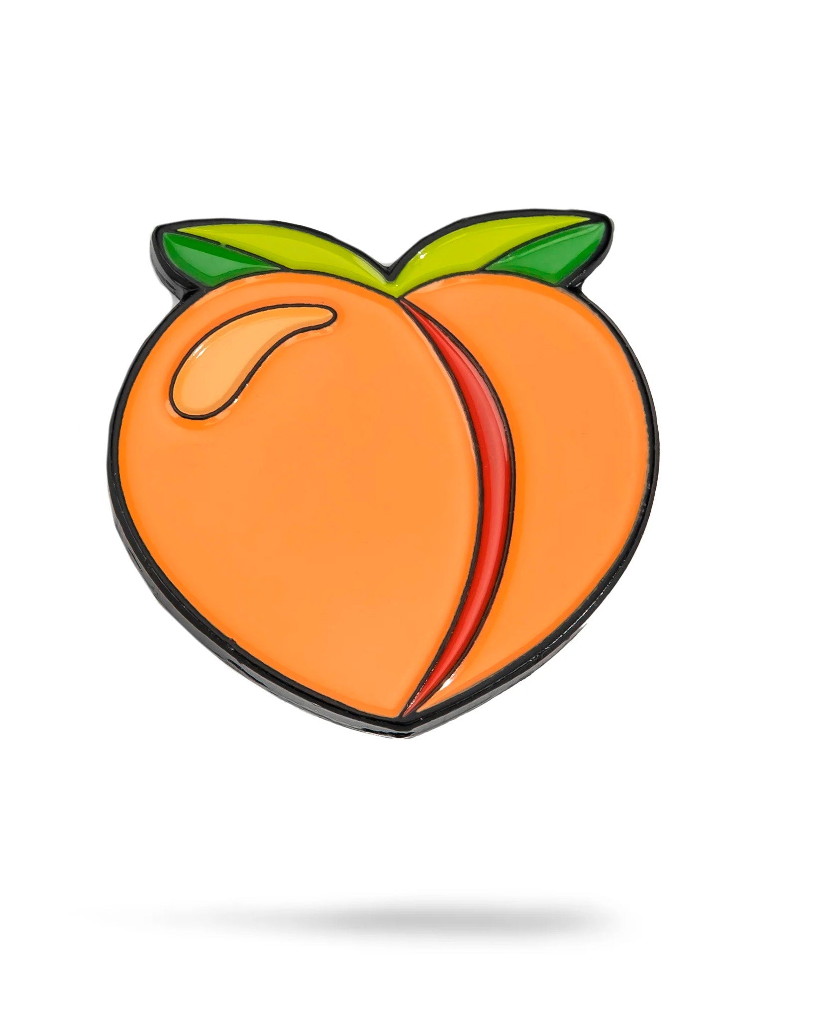 The Peach Ball Marker by Pins and Aces features a stylized peach with two green leaves, black outlining, and a curved highlight on the left side, set against a white background for a clean enamel look.