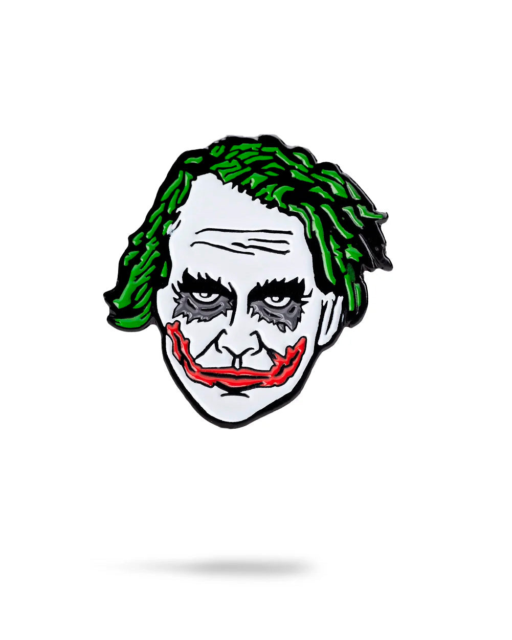 The Pins and Aces Joker Ball Marker 2.0 is a cartoon-style enamel pin featuring the iconic green hair, white makeup, dark eyes, and red smile—ideal for magnetic surfaces or as a unique ball marker.