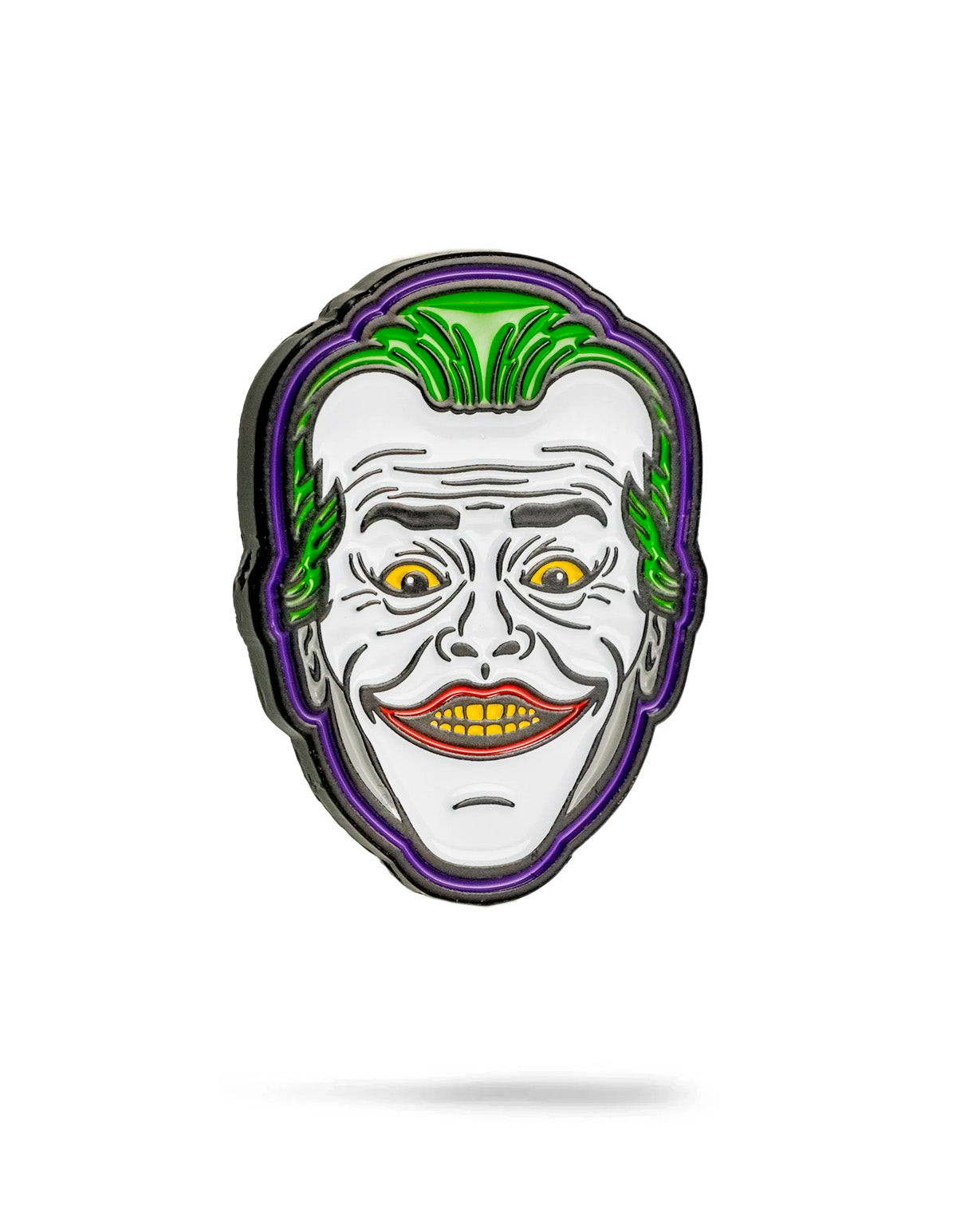 The Joker Ball Marker 3.0 by Pins and Aces is a vibrant enamel pin and golf marker, featuring a grinning face with green hair, yellow eyes, white skin, and red lips—classic comic book villain style on a white background.