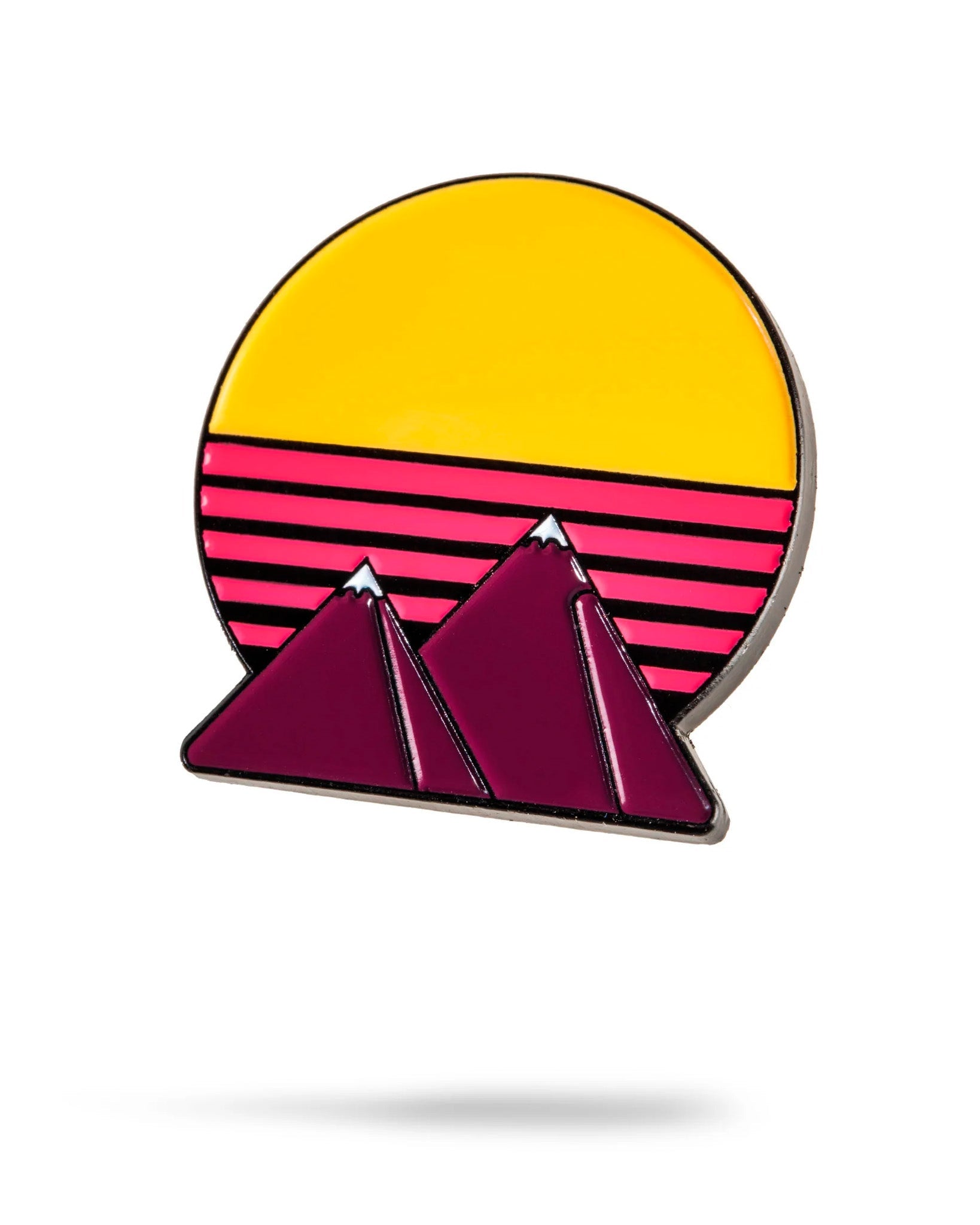 The Colorado Sunset Ball Marker by Pins and Aces features a retro minimalist design with purple mountains, a yellow sun, and vibrant sky stripes—an eye-catching stainless steel golf marker for standout style on the course.