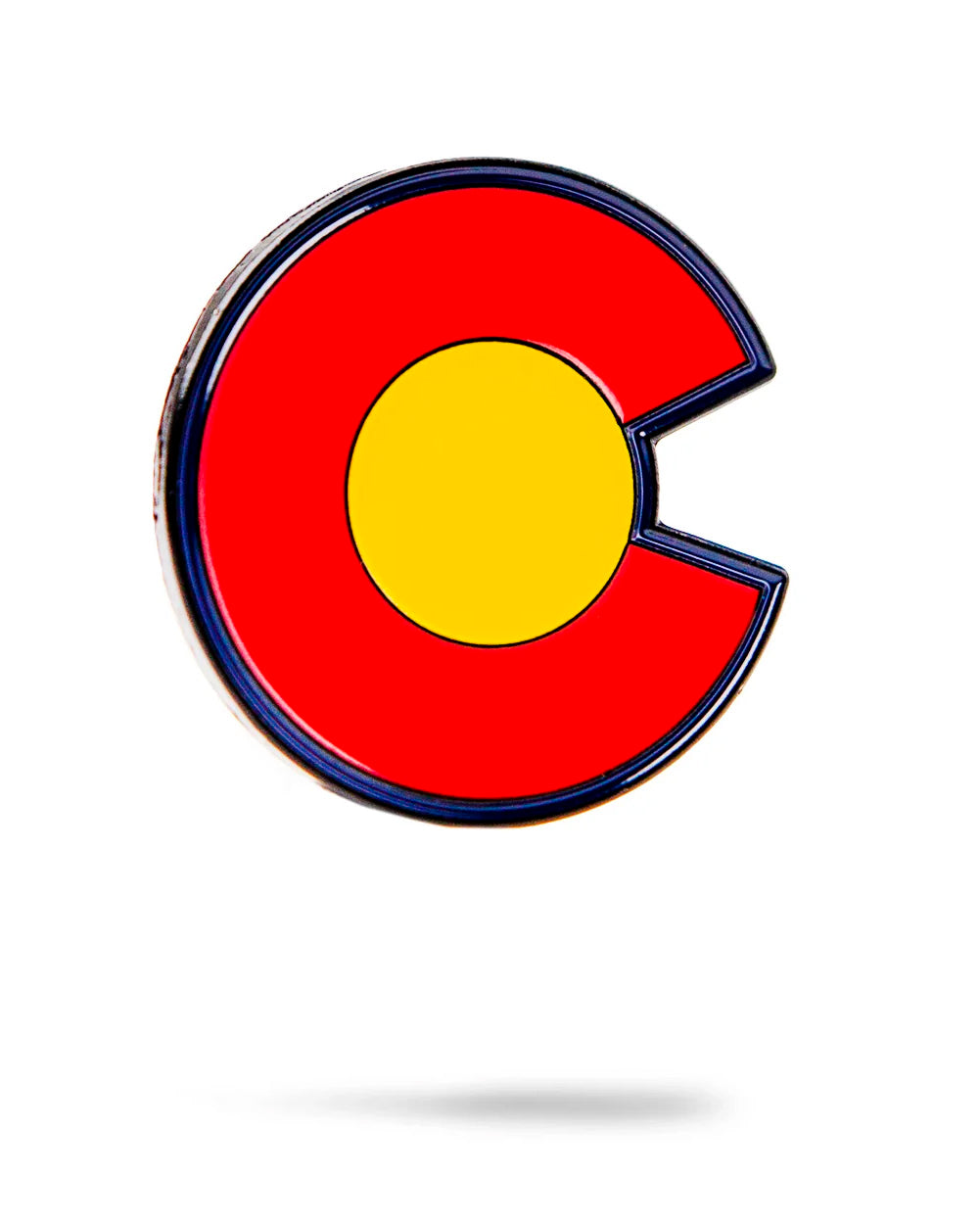 The Colorado Strong Ball Marker by Pins and Aces features the bold red "C" and yellow circle from the Colorado flag, crafted from cast steel—perfect for magnetic surfaces or as a unique ball marker.