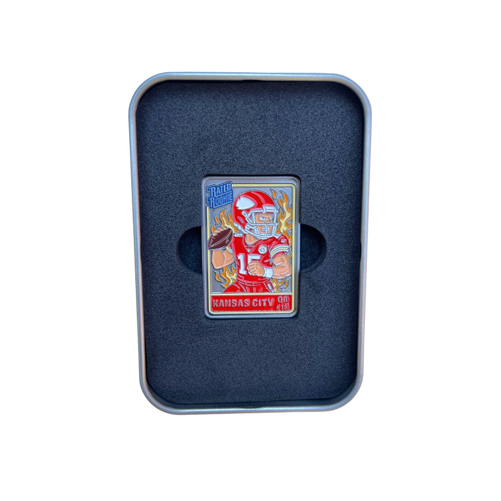 The Pin Creatures Kansas City Trading Card Ball Marker features a football player in red with flames in the background, displayed in black foam inside a metal case—a unique collectible for golf accessories enthusiasts.
