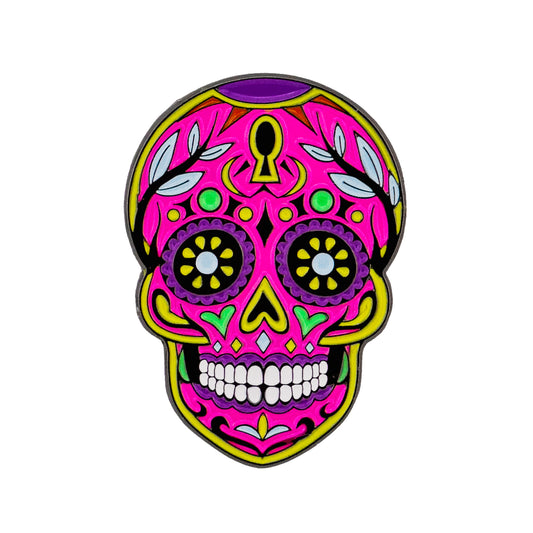 The Sun & Life Sugar Skull Ball Marker by Logie Joe's Golf features a vibrant Dia De Los Muertos-inspired sugar skull in pink, yellow, green, and purple with floral and leaf decorations.