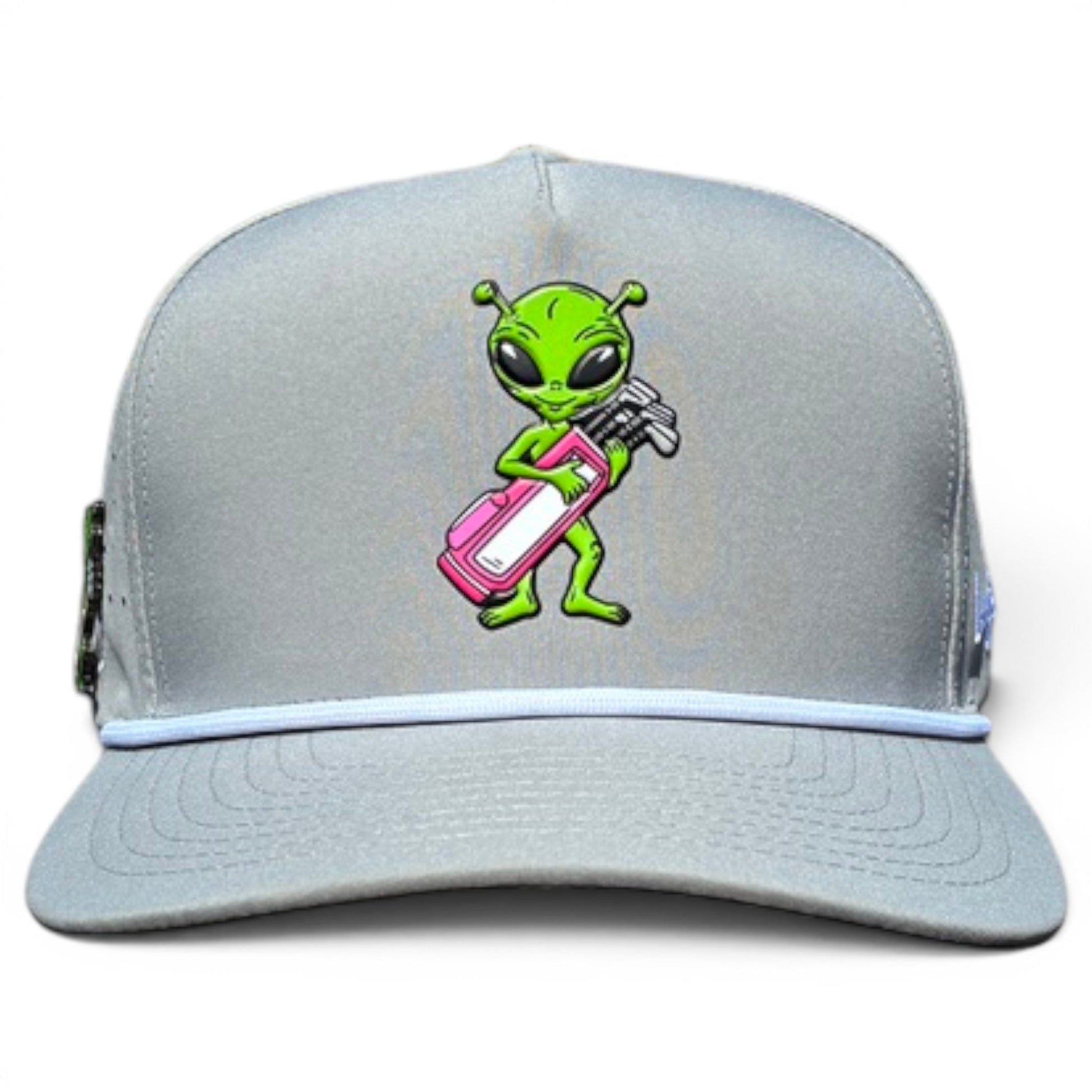 The Logie Joe's Golf Alien Caddy Golf Hat is a light gray snapback cap with a cartoon green alien holding a pink and white golf bag, curved bill, white accent line, and built-in magnetic ball marker holder plus marker included.