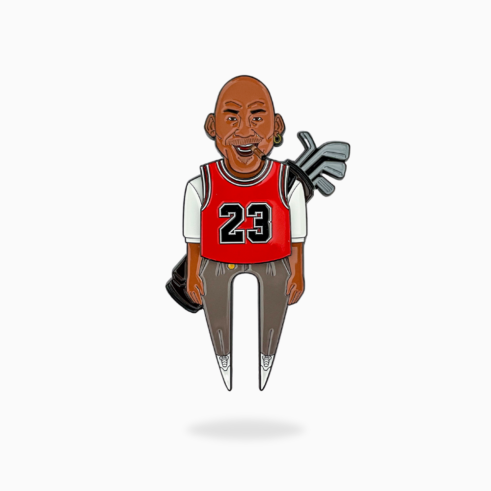 The GOAT 23 by Pin Creatures is a cartoon figure with brown skin and a bald head, wearing a red #23 basketball jersey, cigar in mouth, and carrying a golf bag with clubs and ball marker.