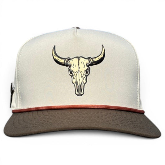 The Longhorn Golf Hat by Logie Joe's Golf is a snapback cap in beige and brown with a tan bull skull graphic, dark brown bill, thin trim, and comes with a built-in magnetic ball marker holder plus marker. Adjustable fit.