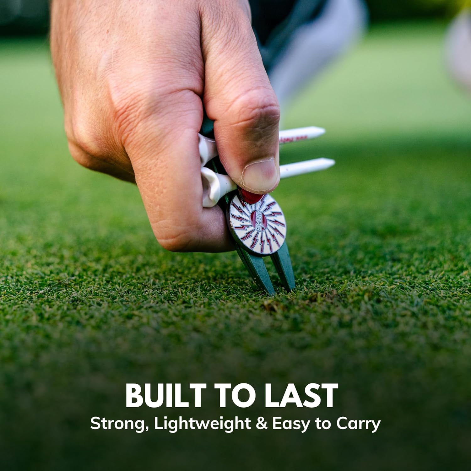 A hand uses THE BYRD GOLF DIVOT CLYP by The Byrd, LLC to repair the green while holding golf tees and a ball marker. Text below: BUILT TO LAST—Strong, Lightweight & Easy to Carry. Low stock—get yours before they're gone!.