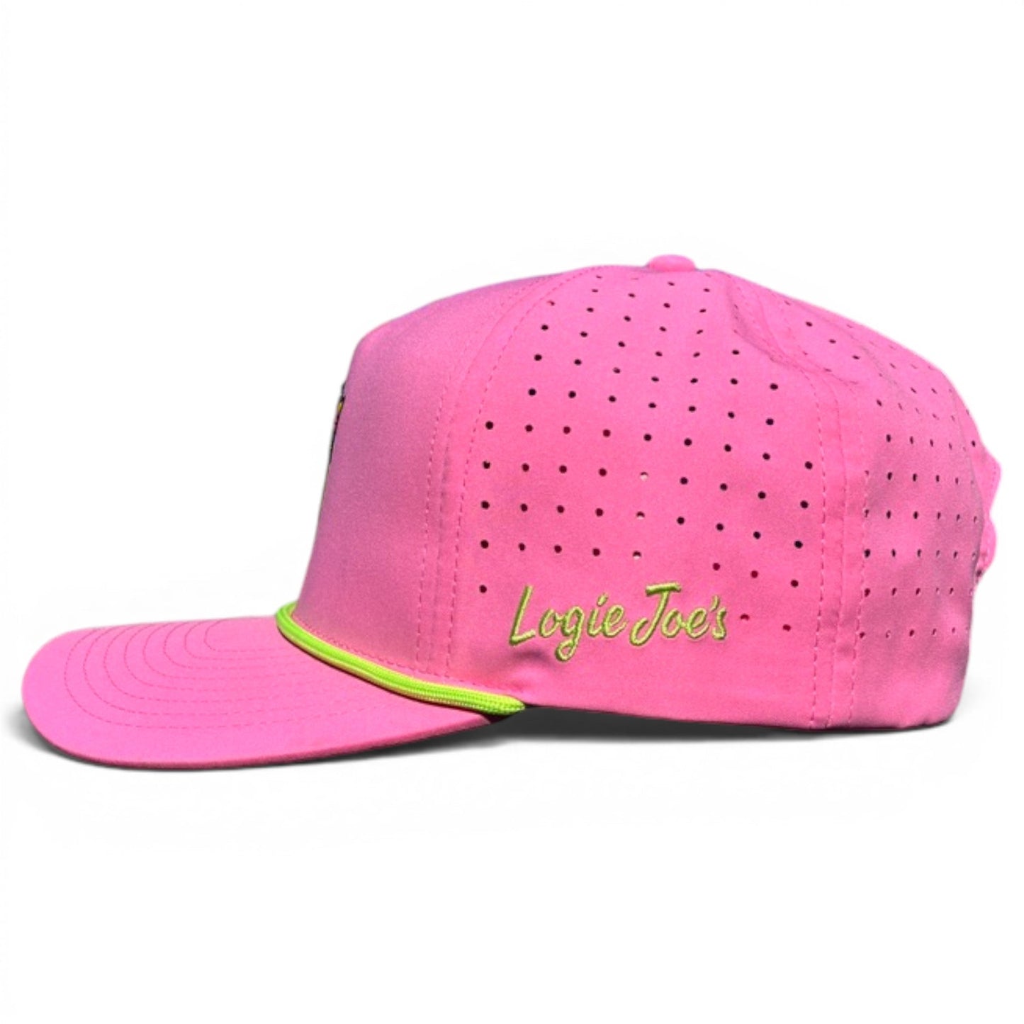 The Coconut Cocktail Golf Hat by Logie Joe’s Golf is a bright pink snapback cap with ventilation holes, yellow-green embroidery, adjustable fit, and a built-in magnetic ball marker holder with marker included for all-day comfort.
