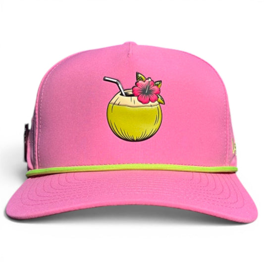 The Logie Joe's Golf Coconut Cocktail Golf Hat is a bright pink snapback cap with a yellow-green brim, coconut drink graphic, adjustable fit, and built-in magnetic ball marker holder plus marker included.
