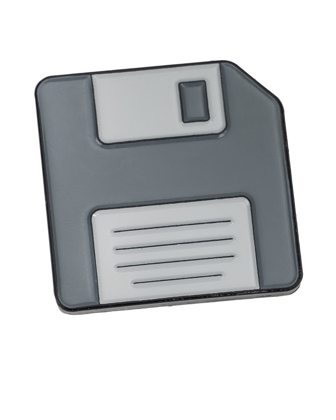 The Pins and Aces Floppy Disc Ball Marker is a gray and white, magnetized golf marker shaped like a floppy disk, featuring a square body, rectangular label area, and detailed shutter design.