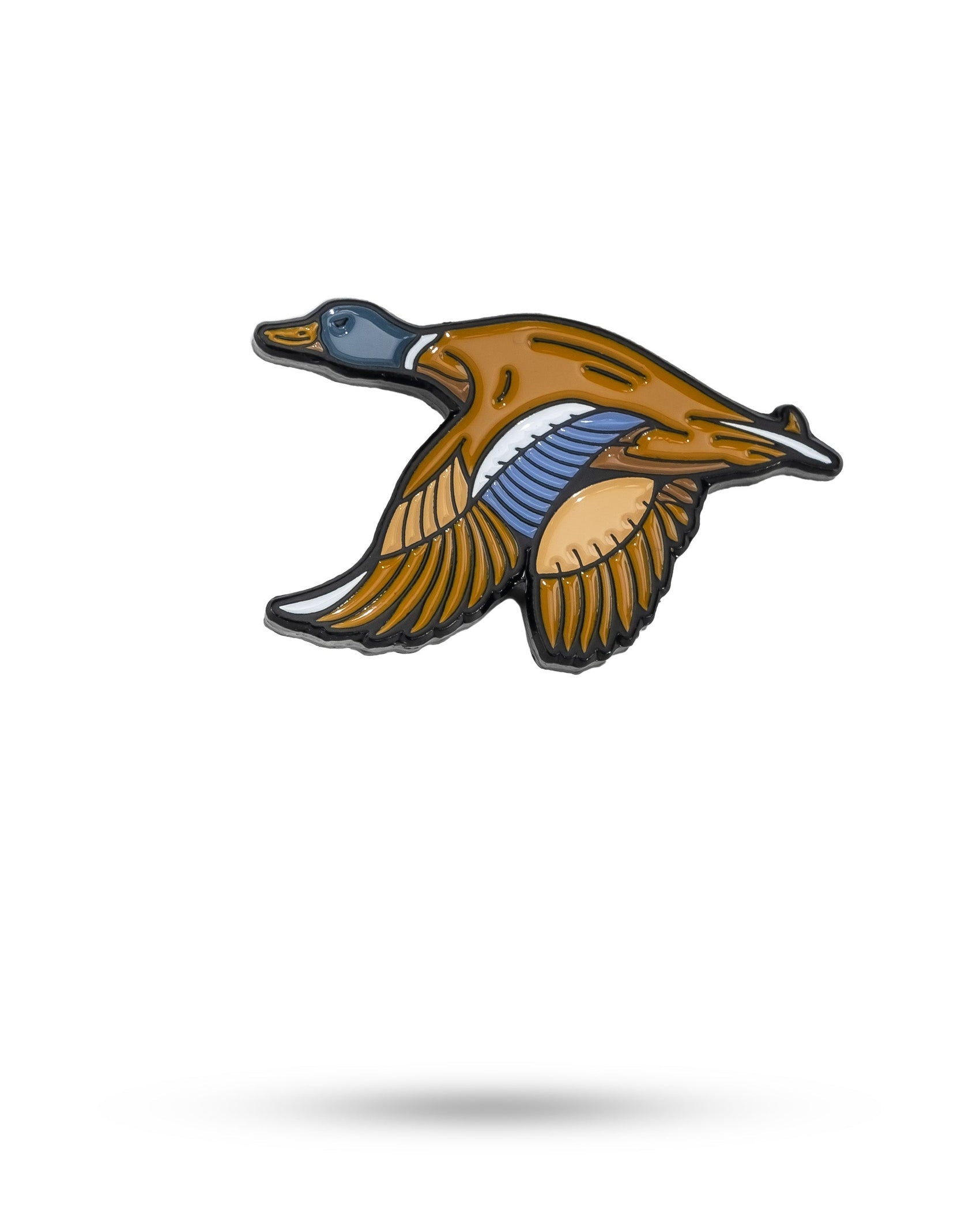 The Pins and Aces Flying Mallard Ball Marker features a colorful enamel design of a flying duck in brown, orange, blue, and white, shown on a white background with a soft shadow.