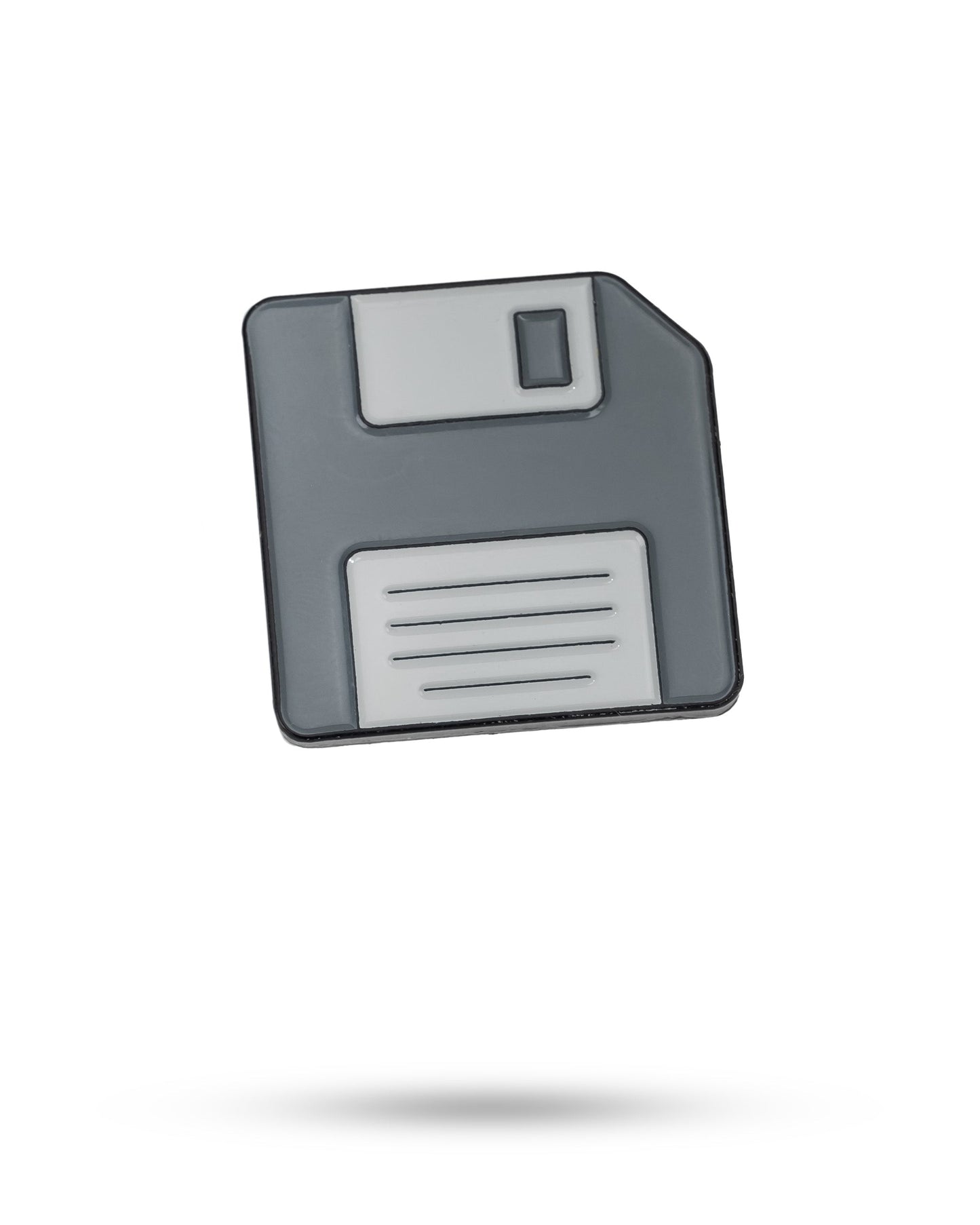 A grey and white Pins and Aces Floppy Disc Ball Marker icon appears on a white background, with a faint shadow beneath it.