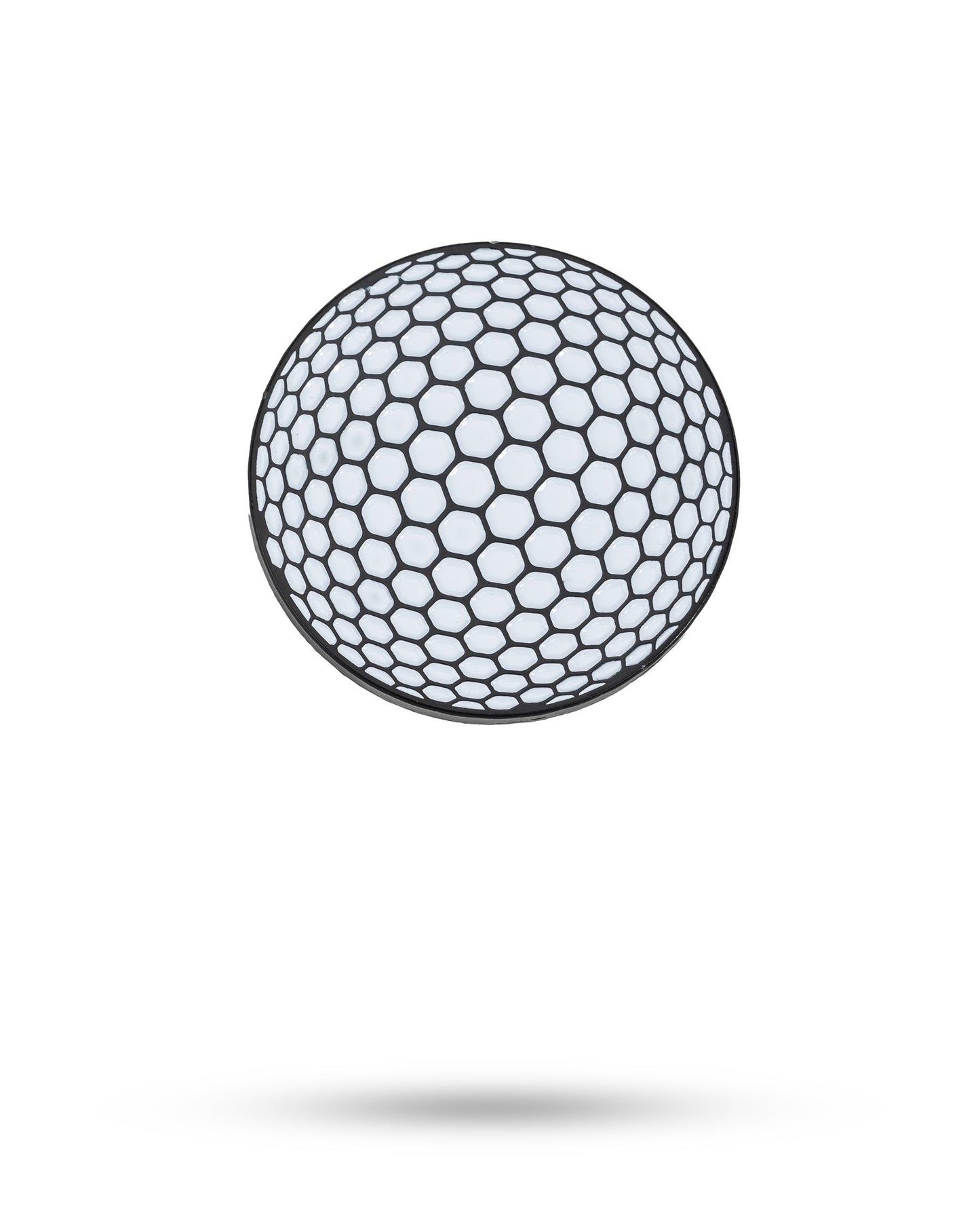 A white Golf Ball Ball Marker by Pins and Aces, featuring a black honeycomb-like hexagonal pattern, floats above a white background with a soft shadow, evoking the look of an enamel paint finish.