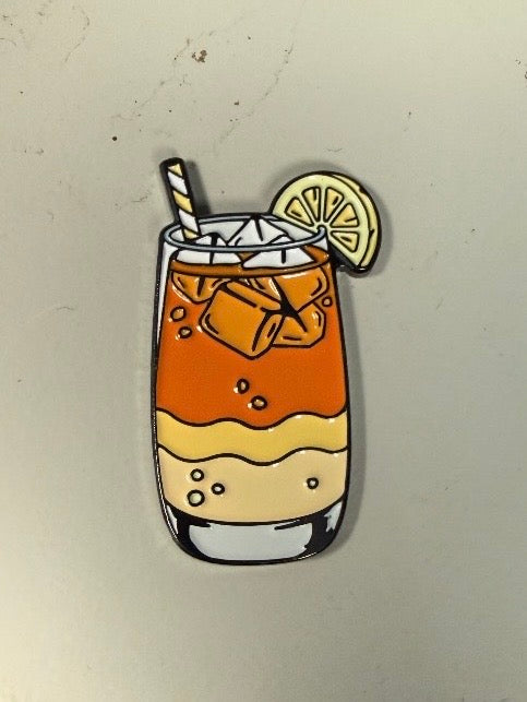 Illustration of Logie Joe's Golf "Half and Half Ball Marker"—a two-toned lemonade iced tea in a glass with ice cubes, a lemon slice, and a striped straw, set against a plain light background—perfect inspiration for your next golf accessory or ball marker design.