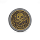 The Omen I by Doubloon is a gold and black titanium coin with an ornate skull and crossbones centerpiece, decorative patterns, and a “MARKS THE SPOT” banner, capturing the style of a classic doubloon.