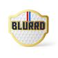 A gold and blue sign showcases THE BLURRD PREMIUM BALL MARKER by BLURRD, a sleek magnetic golf ball marker renowned for its premium design.