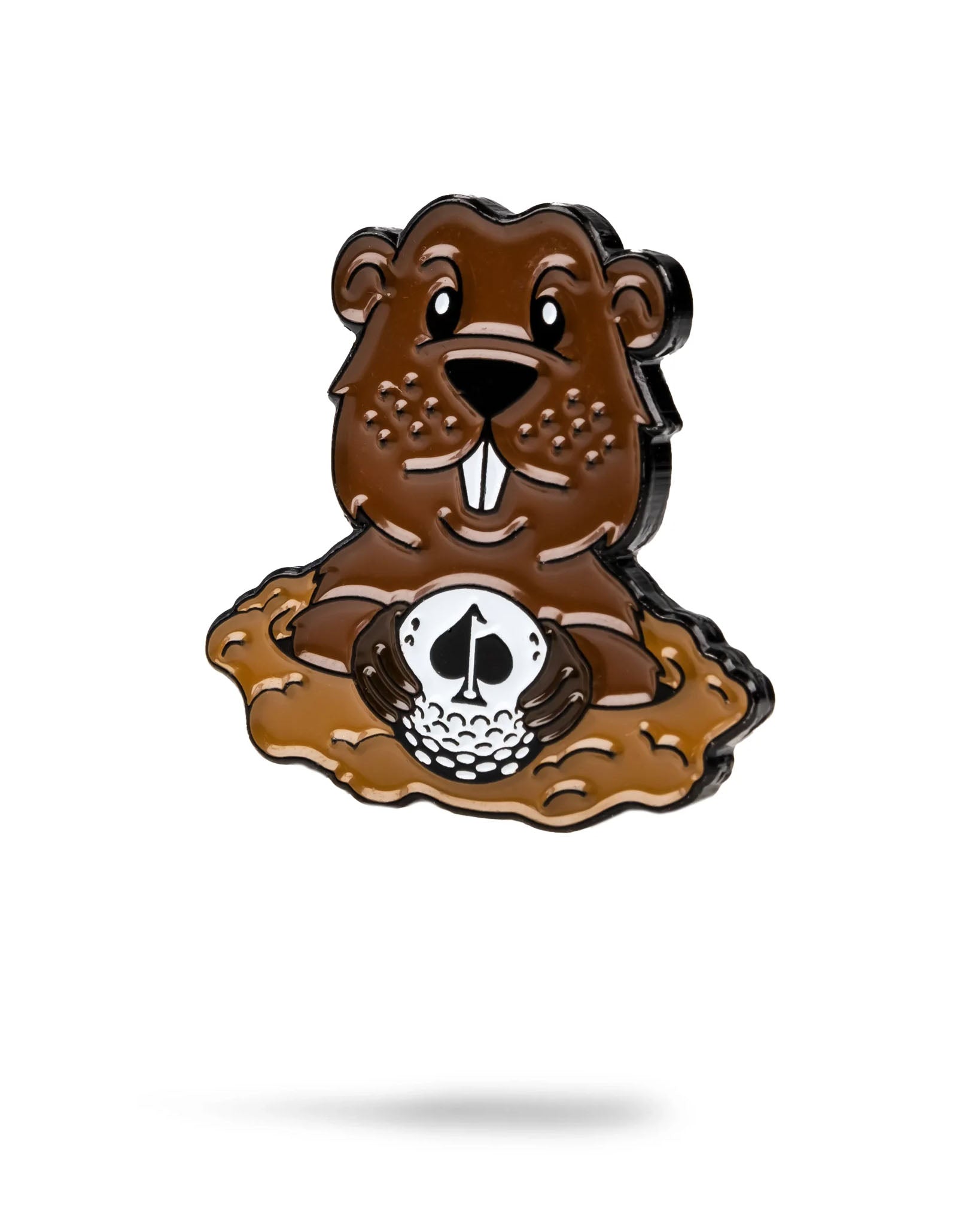The Pins and Aces Gopher Ball Marker features a cartoon gopher emerging from a dirt mound, holding a golf ball with a black spade symbol, set on a white background with its shadow—great for those seeking unique ball markers.