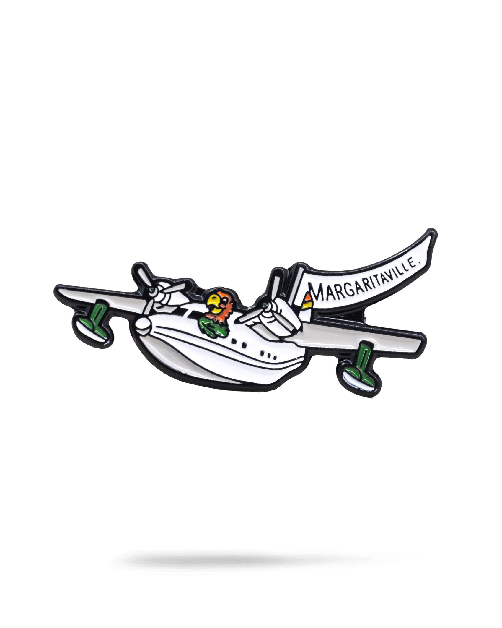 The Margaritaville Hemisphere Dancer Ball Marker by Pins and Aces features a cartoon-style white seaplane with green accents, a parrot near the cockpit, and a MARGARITAVILLE banner on a clean white background with soft shadow.