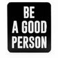 The Be A Good Person - Ball Marker by Pins and Aces features bold white letters on a black background, displaying the inspiring message: BE A GOOD PERSON, in the signature Pins and Aces style.