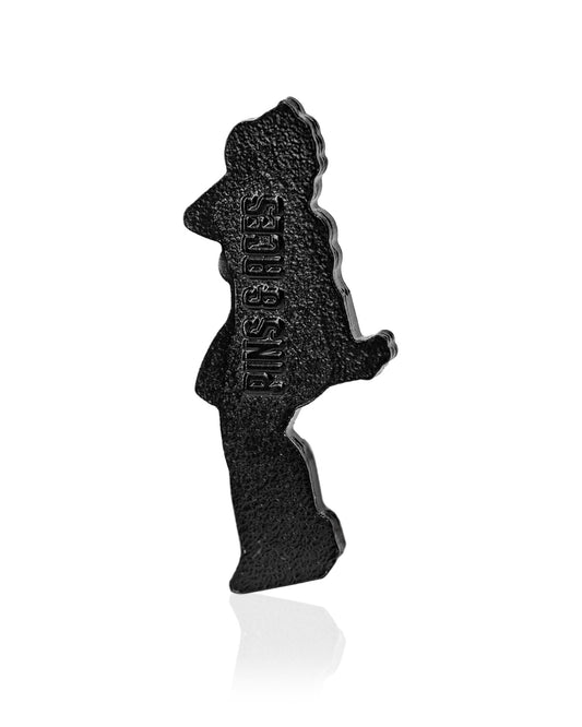The Blazy Susan Silhouette Ball Marker by Pins and Aces is a black, textured pin shaped like a standing person in profile, ideal as a premium golf accessory or magnetic hat clip, shown elegantly against a white background.