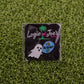 Ballmarkers by Logie Joes Boo Bees includes a ghost-shaped pin and a blue “Boo!” with bees pin on green grass packaging—funny novelty golf ball markers and unique golf gifts.