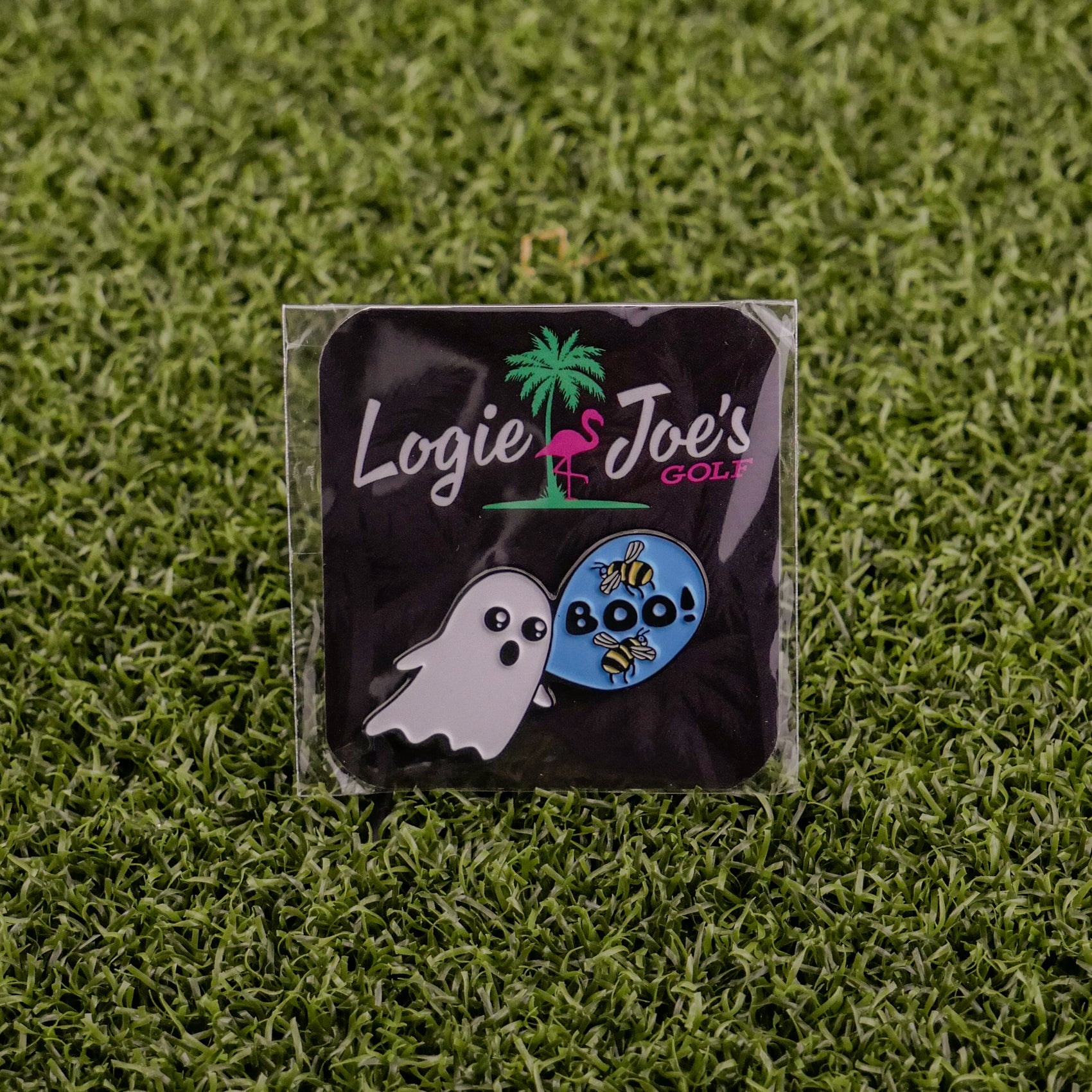 Ballmarkers by Logie Joes Boo Bees includes a ghost-shaped pin and a blue “Boo!” with bees pin on green grass packaging—funny novelty golf ball markers and unique golf gifts.