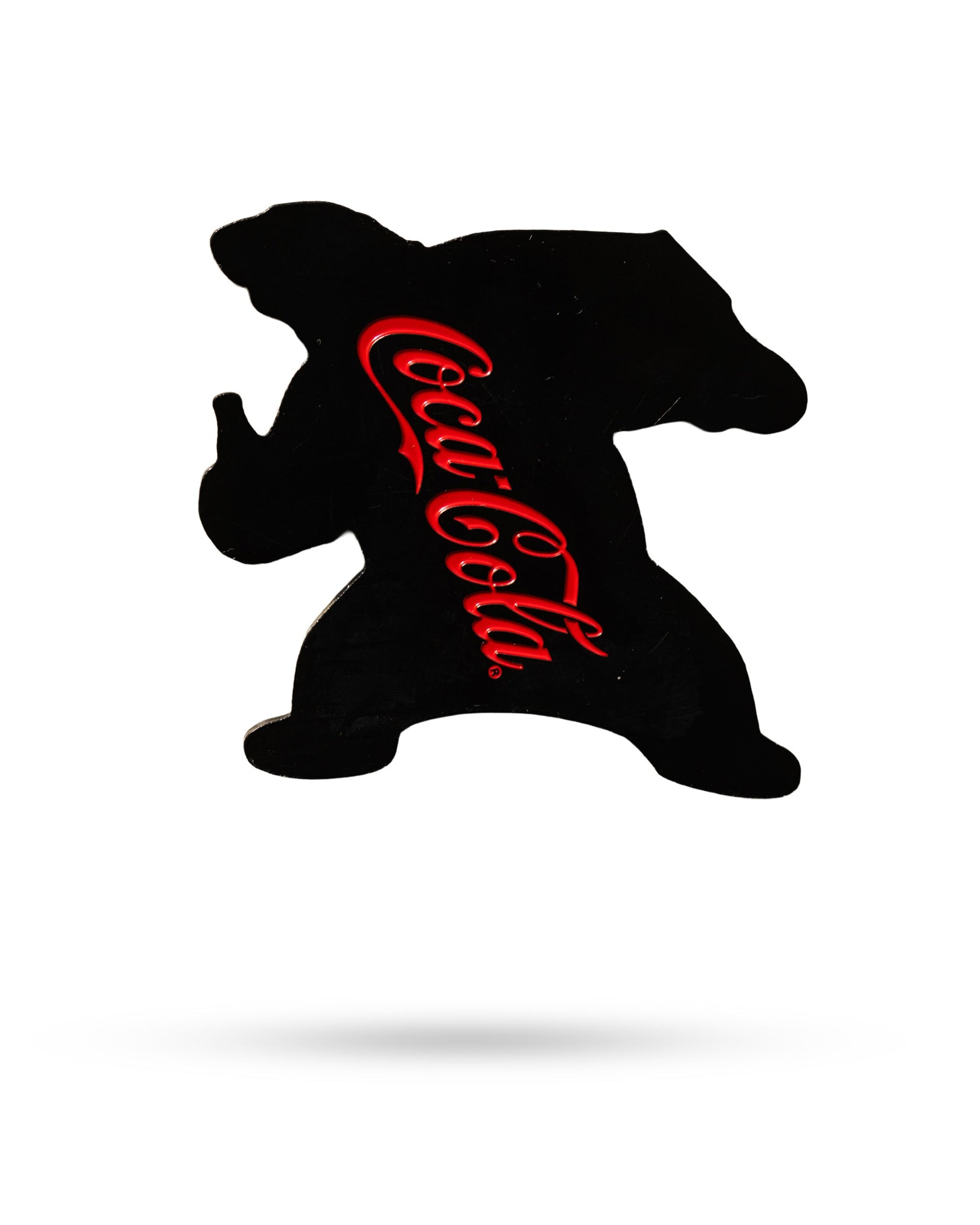 The Coca-Cola Bear - Ball Marker by Pins and Aces features a bear silhouette with the iconic red Coca-Cola logo, set on a white background and accented by a faint shadow.