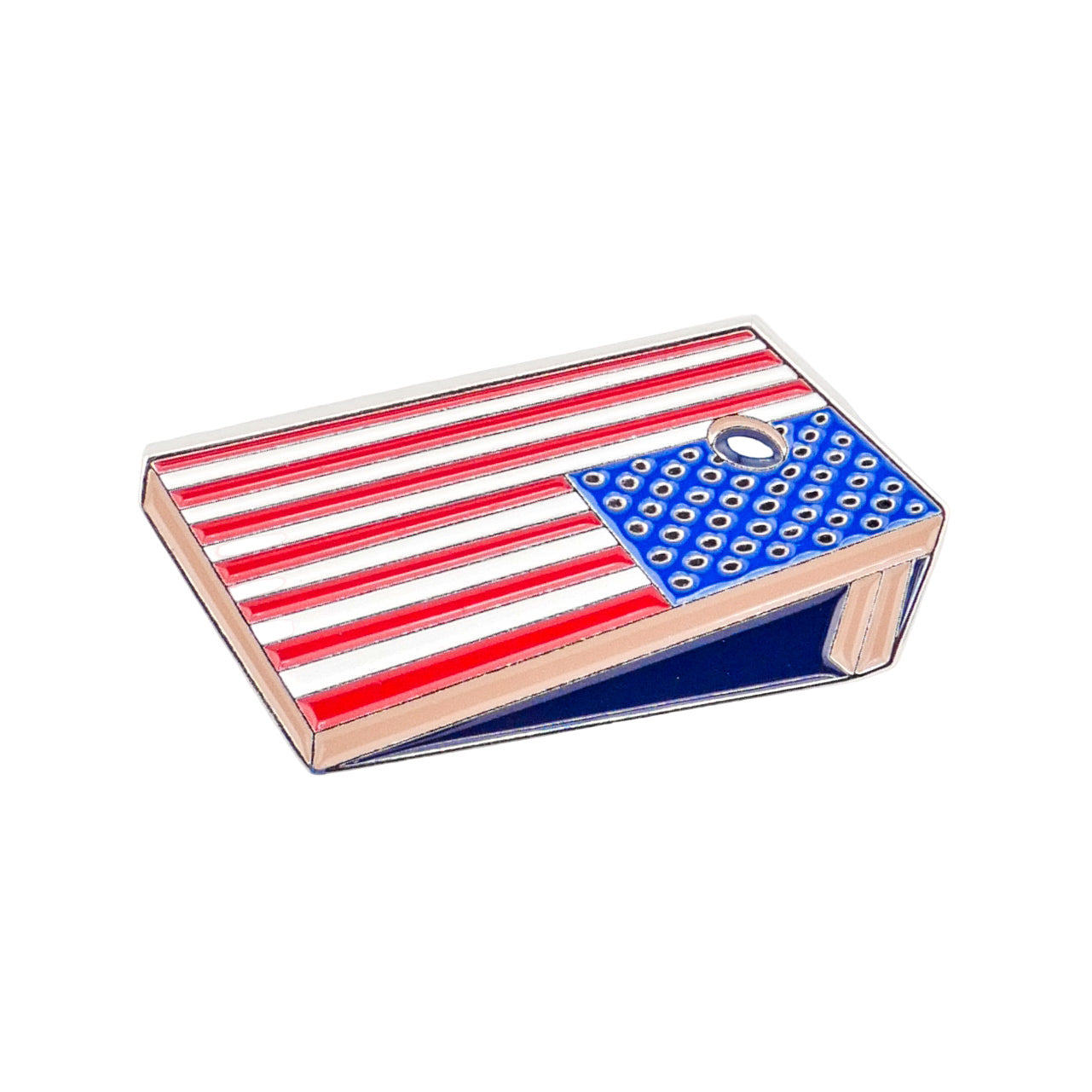 The Corn Hole Board pin by Logie Joe's Golf features an American flag design with red and white stripes, blue with white dots, and a top hole—ideal as a golf ball marker or a fun gift for golfers.