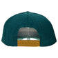 The Logie Joe's Golf Driftwood Golf Hat in Wood Boat Teal is shown from the back, featuring ventilation holes, a built-in magnetic ball marker holder with marker, and a yellow adjustable snapback closure.