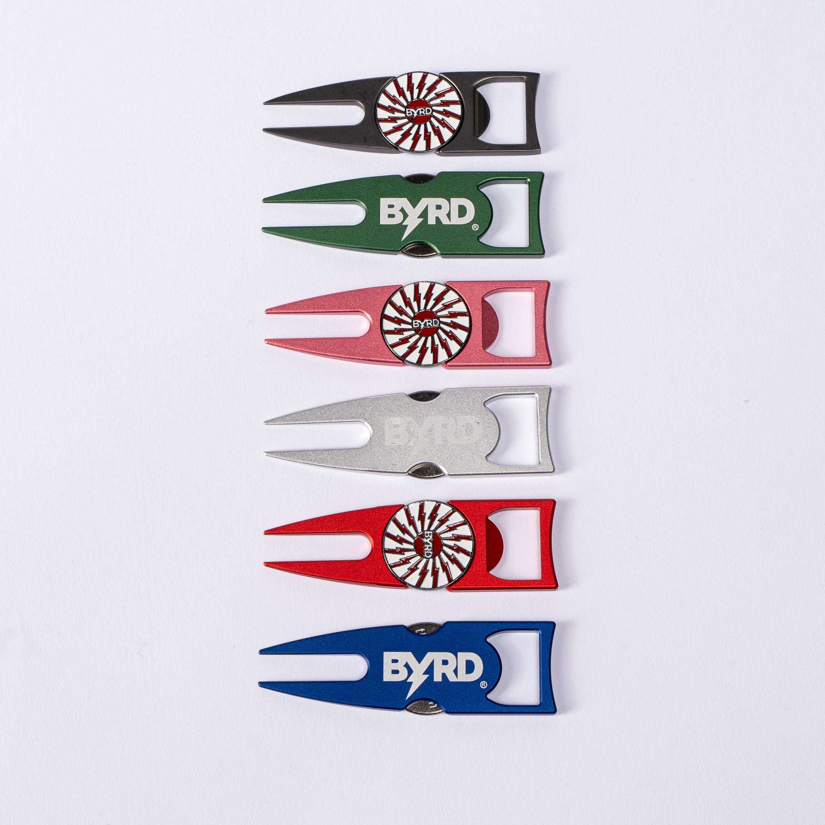 A group of colorful golf tools, featuring The Byrd, LLC BYRD DIVOT TOOL - 4 in 1 multitool and a convenient ball marker holder.