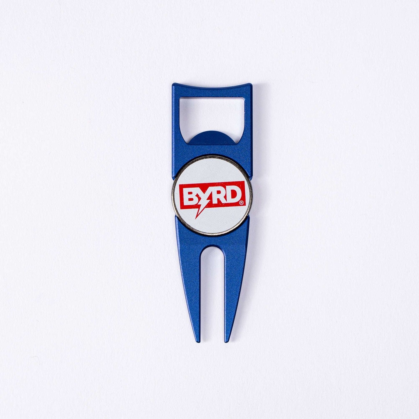 The BYRD DIVOT TOOL - 4 in 1 by The Byrd, LLC is a blue metal golf multitool with a bottle opener and ball marker holder, featuring a white center with the red BYRD logo. It is displayed on a plain white background.