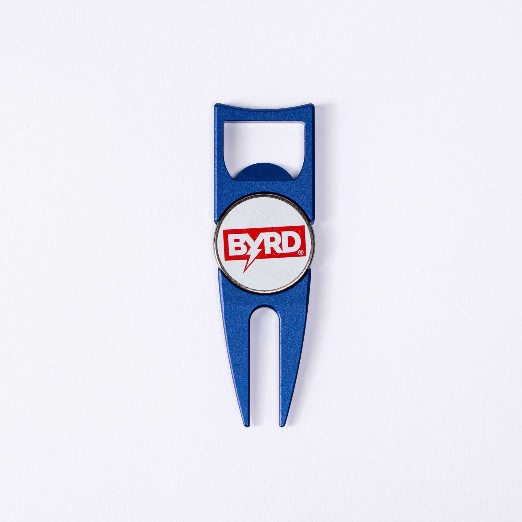 The BYRD DIVOT TOOL - 4 in 1 by The Byrd, LLC is a blue metal golf multitool with a bottle opener and ball marker holder, featuring a white center with the red BYRD logo. It is displayed on a plain white background.