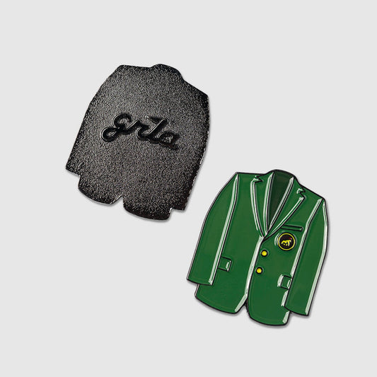Two enamel pins from Guerrilla Golf, called the Green Coat Ball Marker: one displays a classic green jacket with gold buttons and a yellow logo—ideal for golf enthusiasts—while the other reveals the black back side featuring "gala" in raised letters. Both are photographed against a plain light background.
