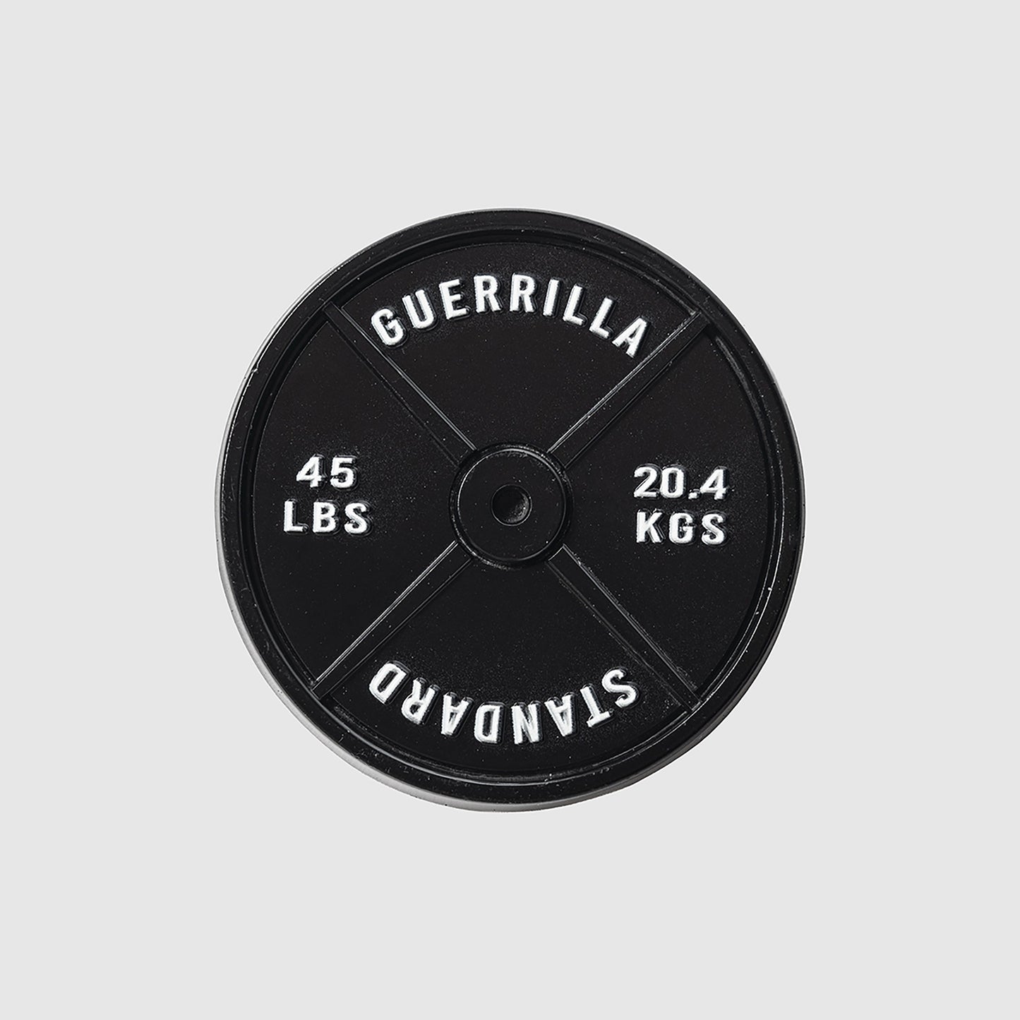 A black 45lb Plate Ball Marker by Guerrilla Golf, featuring "GUERRILLA STANDARD" along with weight markings of 45 LBS and 20.4 KGS in crisp white text against a light gray backdrop—its robust design evokes the industrial strength of a manhole cover.